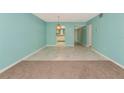 Inviting living room featuring modern tile flooring and soft, light blue walls at 3072 Lake Bayshore Dr # 119, Bradenton, FL 34205
