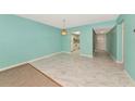 Open-concept living room showcasing modern tile floors and light blue walls at 3072 Lake Bayshore Dr # 119, Bradenton, FL 34205