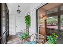 Relaxing balcony features comfortable seating, a hanging plant, and views of the community at 3500 El Conquistador Pkwy # 132, Bradenton, FL 34210