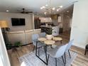 Open-concept living space with a dining area, living room, and kitchen at 4460 Emerald Ridge Dr, Sarasota, FL 34233
