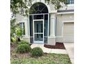 Charming home featuring a screened front porch and a well-maintained landscaped yard at 5981 Willows Bridge Loop, Ellenton, FL 34222
