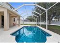 Backyard view of a screened-in pool with a fountain feature and ample patio space at 5981 Willows Bridge Loop, Ellenton, FL 34222