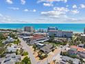 Picturesque aerial view featuring oceanfront condos and quaint residential homes near the coast at 714 & 716 Apalachicola Rd, Venice, FL 34285