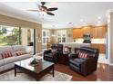 Cozy living space with sliding glass doors and an eat-in kitchen at 8078 Stirling Falls Cir, Sarasota, FL 34243