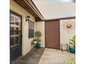 Exterior view of the front entrance featuring an outdoor storage closet at 1227 56Th St W # 1227, Bradenton, FL 34209