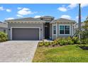 Beautiful single-story home featuring manicured lawn and a neutral gray color palette at 17632 Santorini Ct, Venice, FL 34293