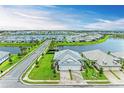 Picturesque aerial view of a stunning lakeside community with lush landscaping and tranquil waterways at 17898 Cherished Loop, Bradenton, FL 34211