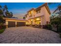 Beautiful home with a large paved driveway, two car garage and manicured landscaping at 1954 Goldenrod St, Sarasota, FL 34239