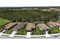 Expansive aerial view of the community, showcasing the home's proximity to natural surroundings at 208 Ariano Ave, Nokomis, FL 34275