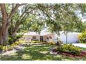 Lovely single-story home, showcasing beautiful landscaping and a welcoming front yard at 2515 Huntington Ave, Sarasota, FL 34232