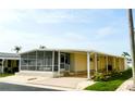Charming single-story home with a screened-in porch and a long carport at 3222 Sycamore Ter, Sarasota, FL 34237