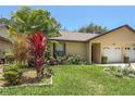 Charming single Gathering home featuring a well-maintained lawn and attached one car garage at 3311 39Th W Pl, Bradenton, FL 34205