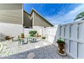 Private patio area with white rock, stone pavers, and a cozy outdoor seating area at 4227 Placid Dr, Sarasota, FL 34243