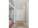 Inviting foyer featuring decorative tiled flooring, and abundant natural light at 6744 Hickory Hammock Cir, Bradenton, FL 34202