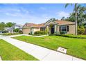 Beautiful single-story home with a well-kept lawn and landscaping at 743 Stonecrest Dr, Sarasota, FL 34232