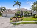 Attractive single-Gathering home featuring beautiful landscaping, an expansive driveway, and a two-car garage at 7513 Coventry Ct, Lakewood Ranch, FL 34202
