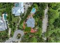 Overhead view of an estate showcasing the layout, landscaping, pool, and proximity to nearby properties at 8963 Fishermens Bay Dr, Sarasota, FL 34231
