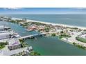 A beautiful view of a canal, beach, houses, and other buildings at 105 Shore Rd, Nokomis, FL 34275