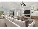 Modern living room with stylish decor, fireplace, and ample seating at 1605 Landfall Dr, Nokomis, FL 34275