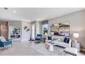 Bright living room features tile floors, neutral paint, and stylish decor at 18051 Cropside Trl, Lakewood Ranch, FL 34211