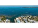 Waterfront home with dock, lush landscaping, and breathtaking ocean views at 236 S Harbor Dr, Holmes Beach, FL 34217