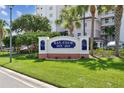 The Bay Club community sign surrounded by lush green lawn and landscaping at 2825 Terra Ceia Bay Blvd # 1804, Palmetto, FL 34221