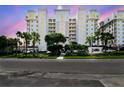 Elegant condo building featuring manicured landscaping and well-lit exterior at 2825 Terra Ceia Bay Blvd # 1804, Palmetto, FL 34221