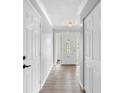 Bright foyer features wood-look flooring and an ornate glass front door with fresh, neutral paint at 3631 Palm Dr, Punta Gorda, FL 33950