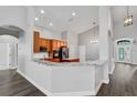 Open kitchen featuring granite countertops, breakfast bar, stainless appliances, and wood cabinets at 4360 85Th Avenue E Cir, Parrish, FL 34219