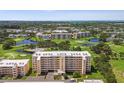 Aerial view of the condo community with lakes, golf courses, and lush greenery at 4460 Fairways Blvd # 607, Bradenton, FL 34209