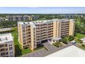 Multi-story condo building with parking and manicured landscaping on a clear day at 4460 Fairways Blvd # 607, Bradenton, FL 34209
