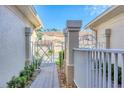 Brick paver walkway leading to the front door through a private gated entrance at 4487 Cinnamon Dr # 2604, Sarasota, FL 34238