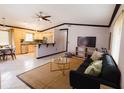 Open-concept living space featuring a stylish living room and adjacent kitchen at 4945 Camphor Ave, Sarasota, FL 34231