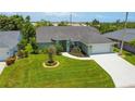 Charming single-story home with a well-manicured lawn and attached two car garage at 5207 86Th Street W Ct, Bradenton, FL 34210
