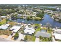 Waterfront homes featuring mature trees and docks along canal community at 619 Albee Farm N Rd, Nokomis, FL 34275