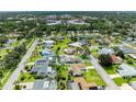 Expansive aerial view of a charming neighborhood, highlighting a lovely home with mature trees at 6804 19Th W Ave, Bradenton, FL 34209