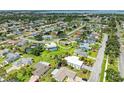 Aerial view of a neighborhood featuring a home, showcasing its location among lush greenery and the community at 6804 19Th W Ave, Bradenton, FL 34209