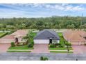 Birds-eye view showing the home's location in a community with mature trees and well-kept lawns at 7119 67Th E Ter, Bradenton, FL 34203