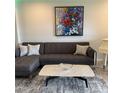 Cozy living room showcasing stylish sofa, marble-top coffee table, and eye-catching artwork at 7325 Skybird Rd # 0, Bradenton, FL 34209