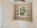 Bright bedroom with shuttered windows offering a view of the well-kept exterior landscaping at 866 Oak Briar Ln, Osprey, FL 34229