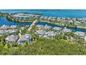 Scenic aerial view of a beautiful community with homes nestled by waterways and lush greenery, offering serene living at 315 Sapphire Lake Dr # 101, Bradenton, FL 34209