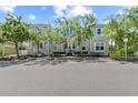 Charming two-story home with a welcoming porch and manicured landscaping, offering curb appeal and a cozy entrance at 315 Sapphire Lake Dr # 101, Bradenton, FL 34209