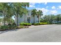 Charming two-story home featuring tropical landscaping, offering a serene and inviting curb appeal in this lovely community at 315 Sapphire Lake Dr # 101, Bradenton, FL 34209