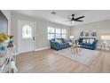 Cozy living room with a decorative front door, recessed lighting, and comfortable seating arrangement at 3153 Irving St, Sarasota, FL 34237
