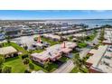 High aerial view of a waterfront neighborhood showcasing boat docks, water access, and lush landscaping at 3876 Catalina Dr, Bradenton, FL 34210