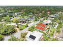 Charming home in a quiet neighborhood with lush greenery and mature trees surrounding the property at 3903 Bayside Dr, Bradenton, FL 34210