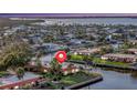 Beautiful waterfront home with lush landscaping and mature trees overlooking the serene canal and stunning bay views at 4096 El Dorado Cv, Bradenton, FL 34210