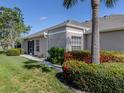 A well-maintained single-story home with manicured landscaping at 4153 Fairway Dr, North Port, FL 34287