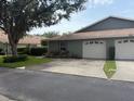 A well-maintained house with a two-car garage and lush lawn at 4176 Center Pointe Cir # 70A, Sarasota, FL 34233