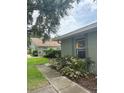 A cozy home with a well-maintained yard and a paved walkway leading to the entrance at 4176 Center Pointe Cir # 70A, Sarasota, FL 34233